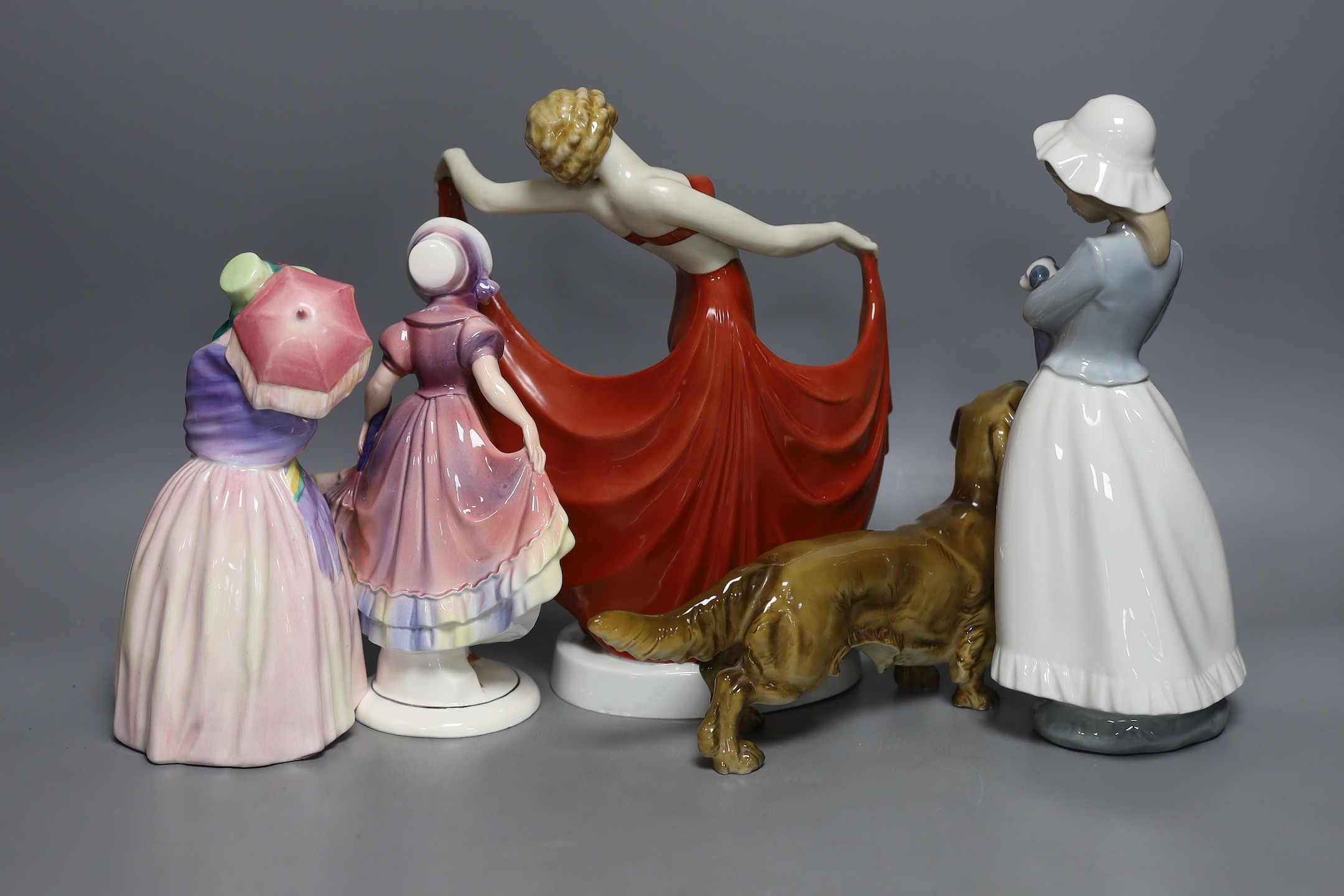 Four mixed figurines and a model of a dog, to include a Royal Doulton figure ‘Miss Demure’ (5)